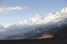 scenic view of mountains and clouds