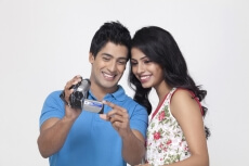 couple with video camera