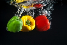 coloured capsicums in water 