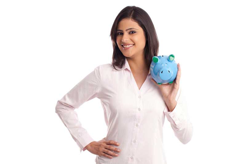 woman in a pink shirt posing with a blue piggy bank