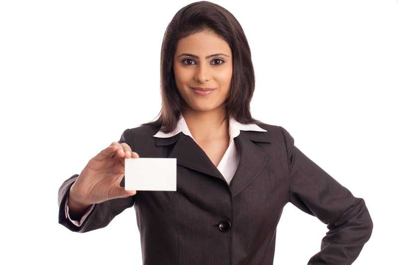 professional woman showing blank card while posing for the camera
