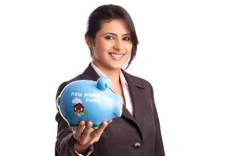smart female professional posing with piggy bank on white background 