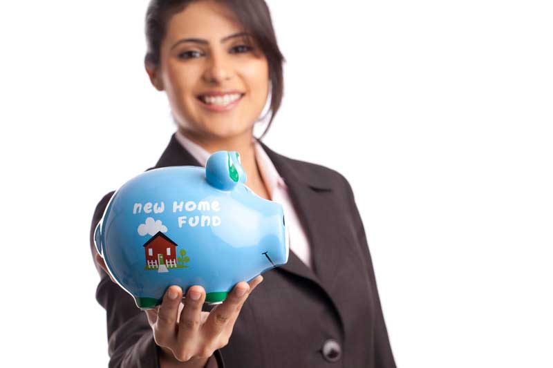 girl with new home fund piggy bank