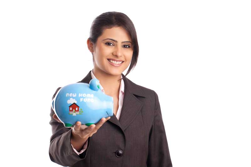 young professional girl showing piggy bank