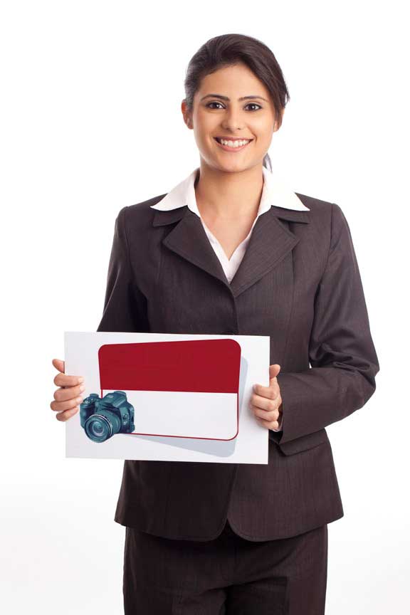 Girl dressed in formals holding card board