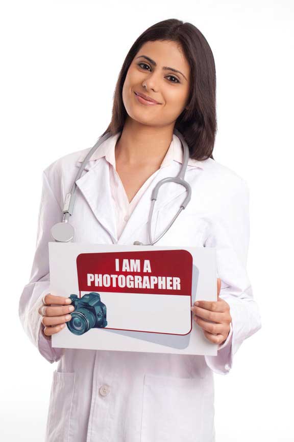 female doctor posing with a message board