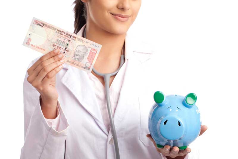lady doctor showing piggy bank and rupee note