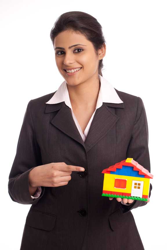 young businesswoman holding  a small house model