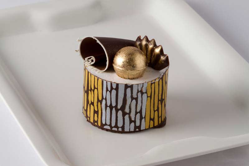 chocolate mousse with gold decoration