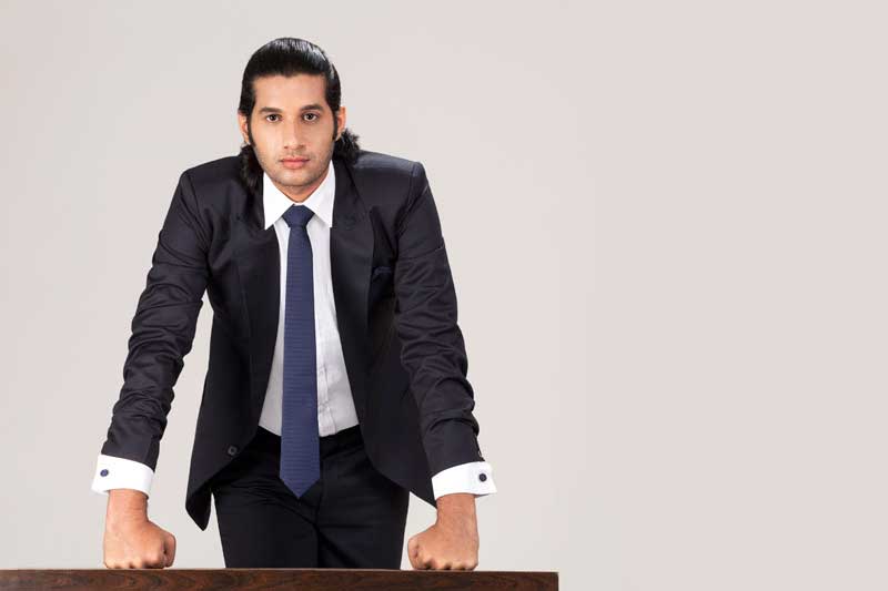 businessman posing on table with copy space for advertising purposes 