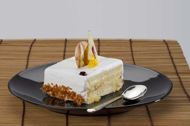 piece of vanilla cake on table 