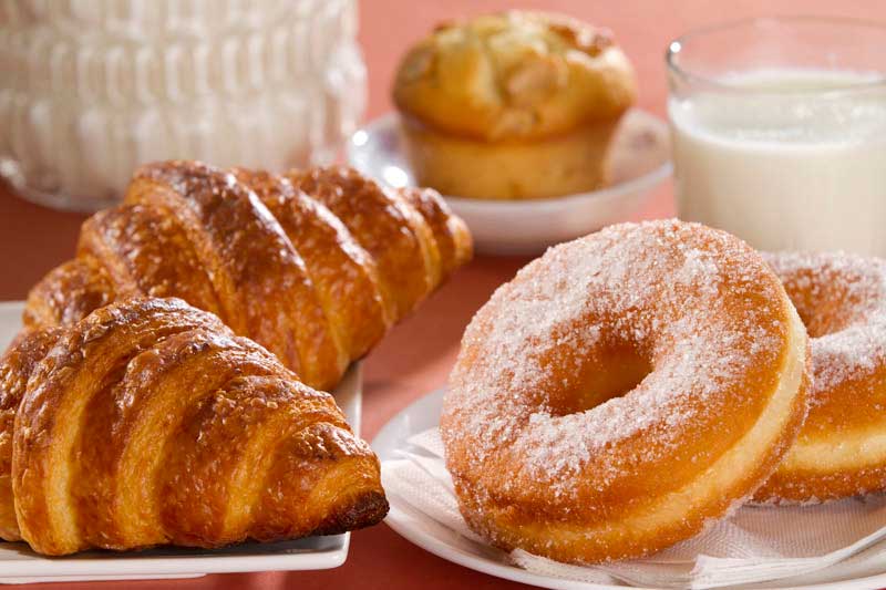 sweet donuts with croissants on a plate