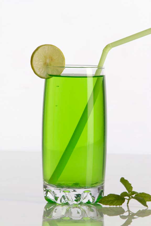 green coloured soda drink with lemon and mint