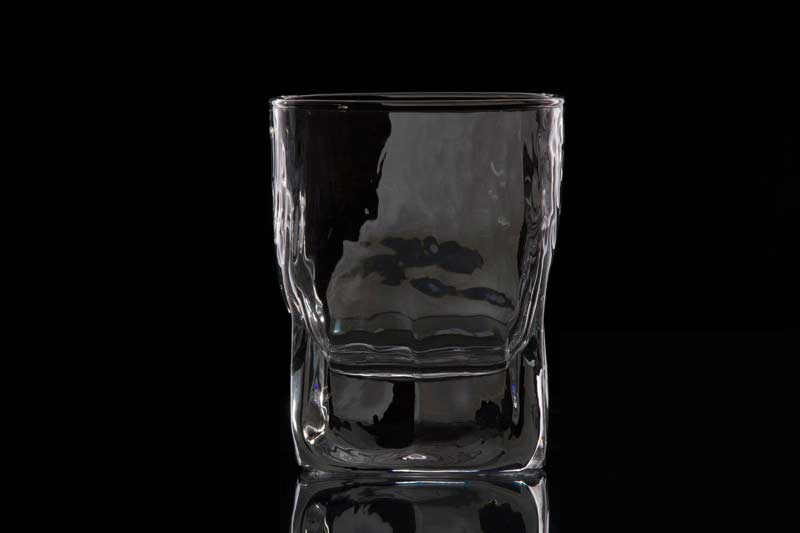 an empty glass of scotch