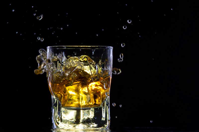 whiskey splashing from a glass