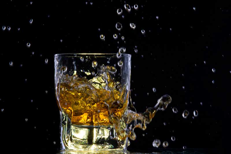 whiskey splashing from a glass