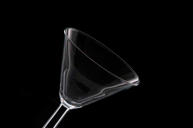 empty cocktail glass on a dark background