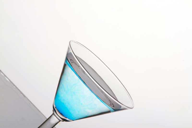 blue martini in a cocktail glass