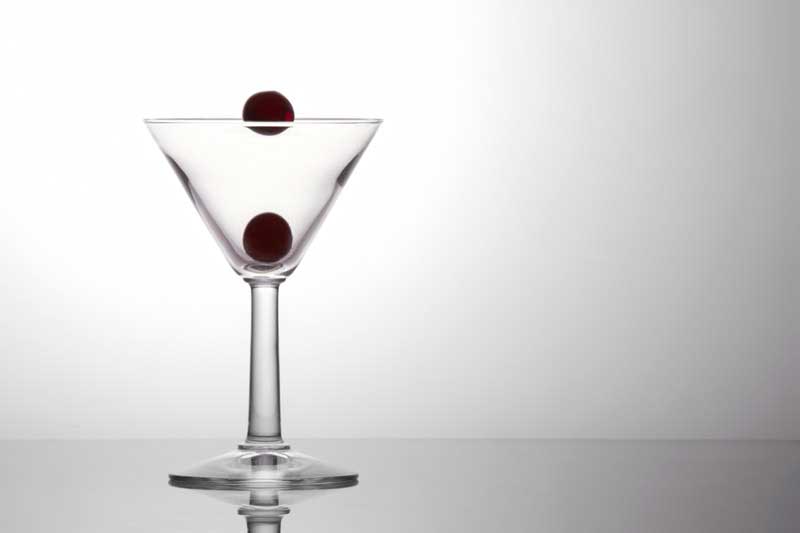 fresh grapes in a cocktail glass isolated on a white background