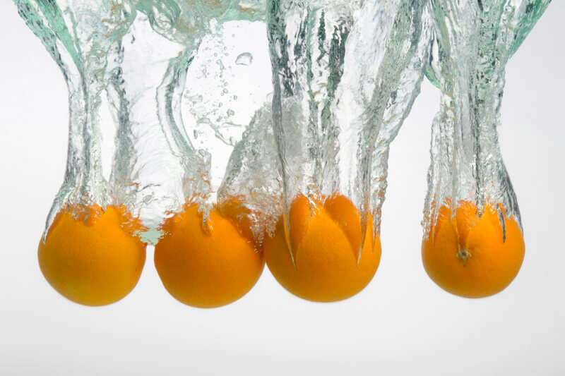 oranges immersed in water creating an art