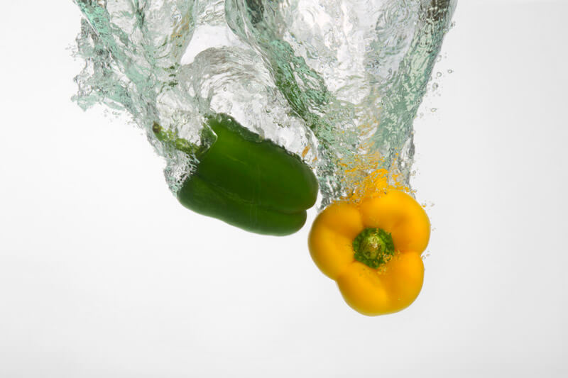fresh capsicums dropped in water