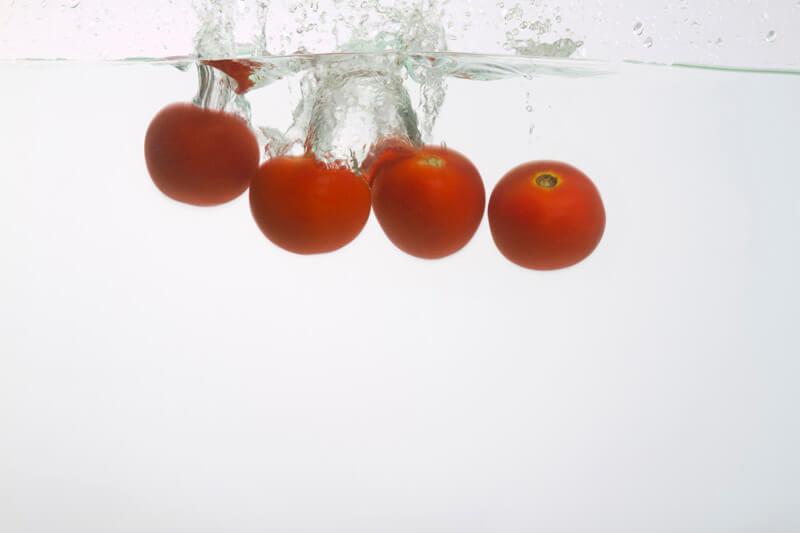 tomatoes splashed in water