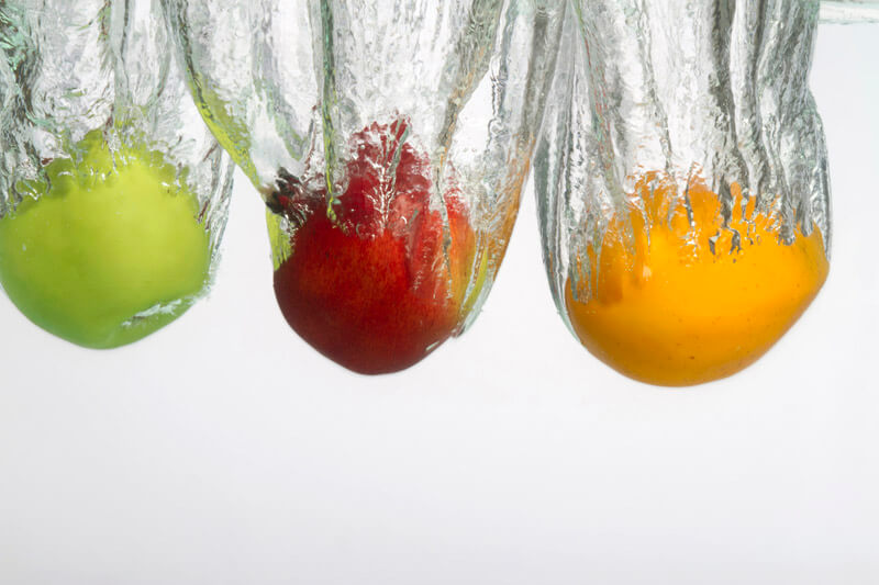 fruits in water against white background 