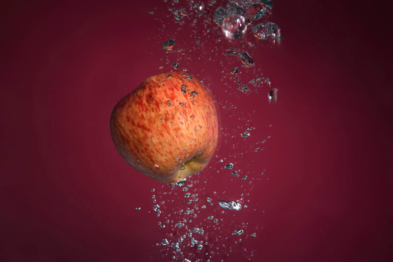 apple dropped into water