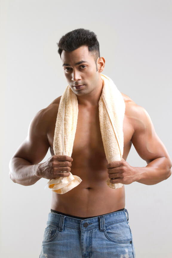 man posing with a towel