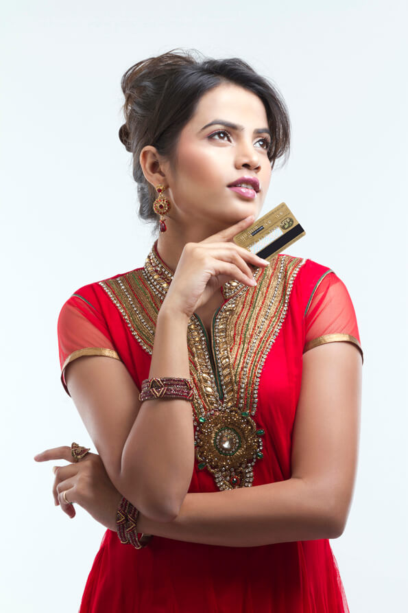 girl in ethnic wear holding a credit card