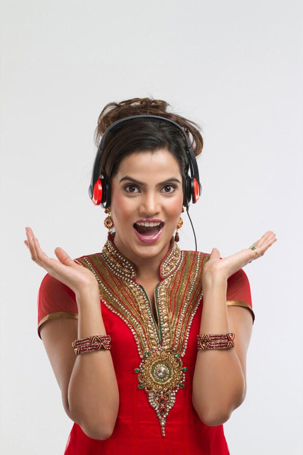 girl in ethnic wear with headphones