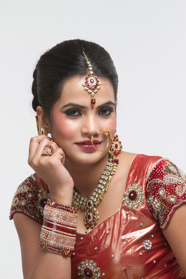 indian bride in bridal wear posing 
