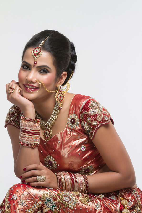 indian bride in bridal wear posing 