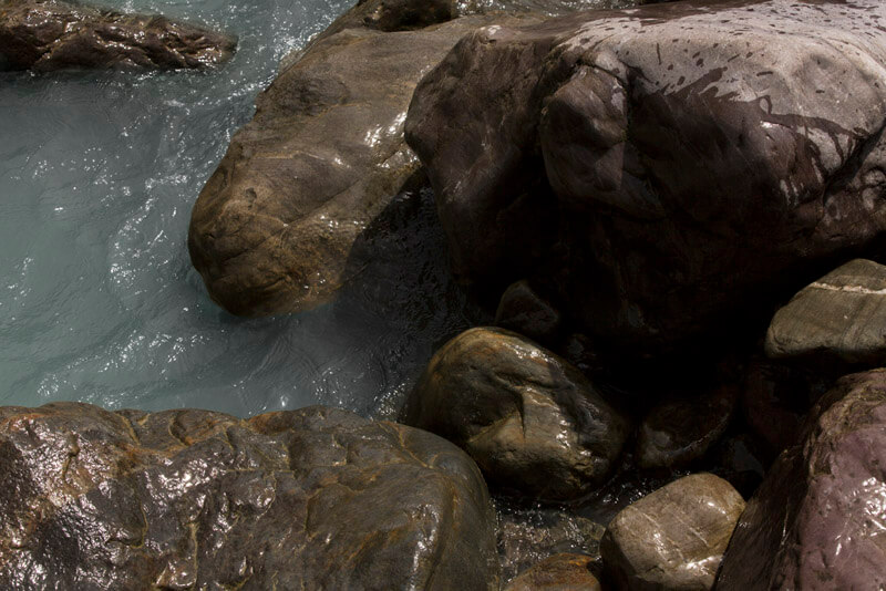 water flowing through stones