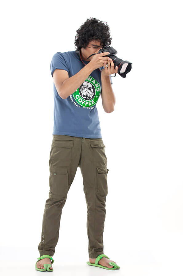 young boy taking photo isolated on white background