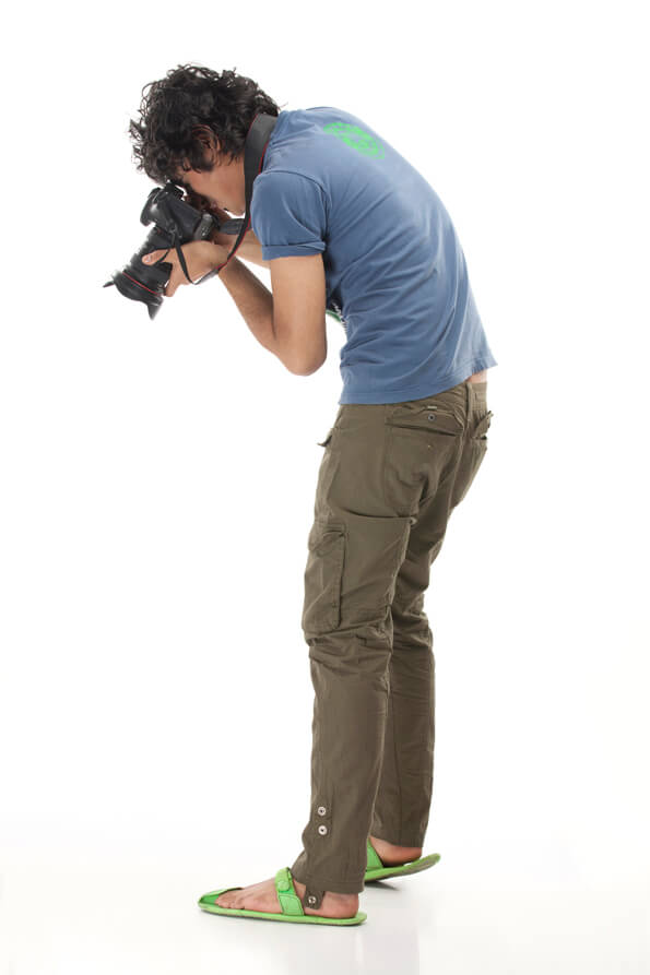 male photographer zooming at the ground