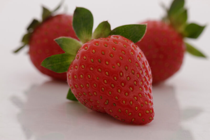 three fresh strawberries