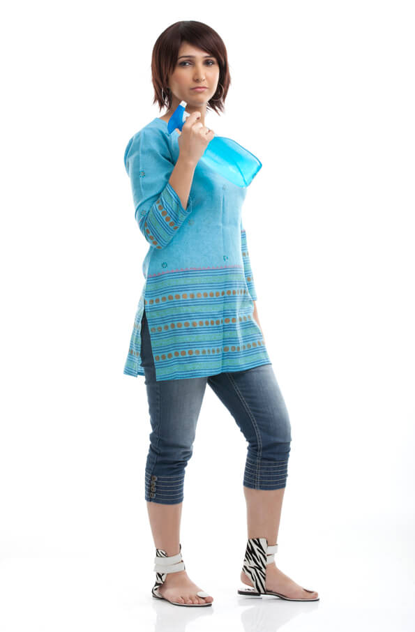 housewife in a blue kurta holding house cleaning product