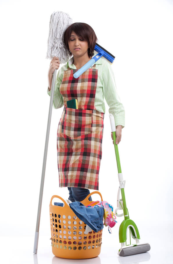 woman standing in cleaning uniform with a sad and disturbed expression