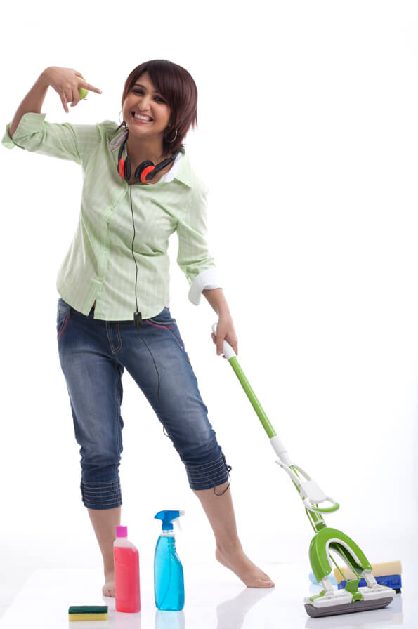 woman with headphones washing the floor