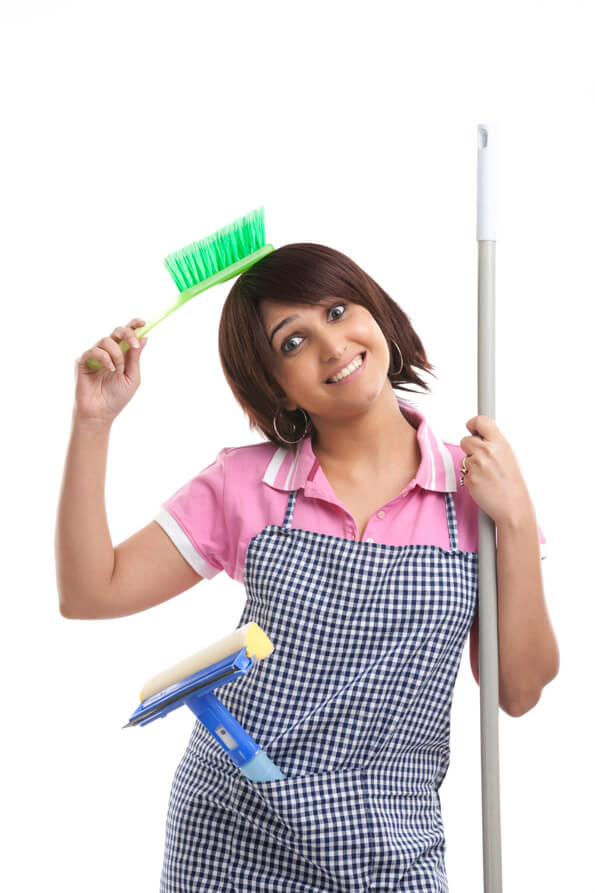 housewife holding a mop and brush