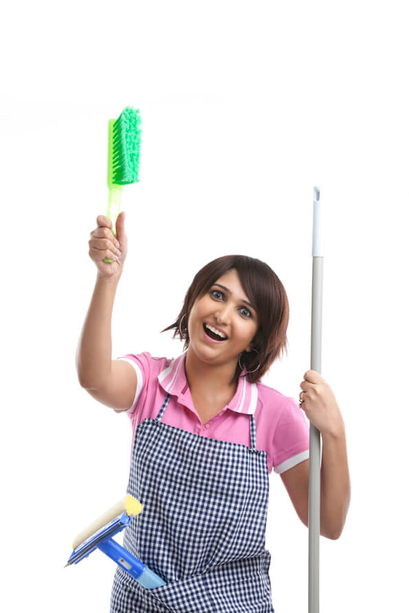 woman holding a cleaning brush and a mop