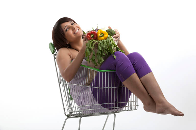woman happy with her bag of vegetables