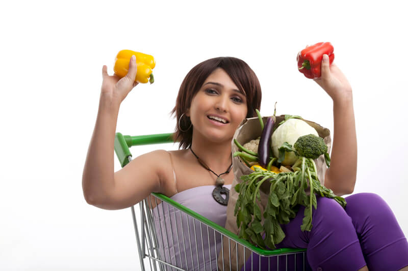 women with bag of vegetables