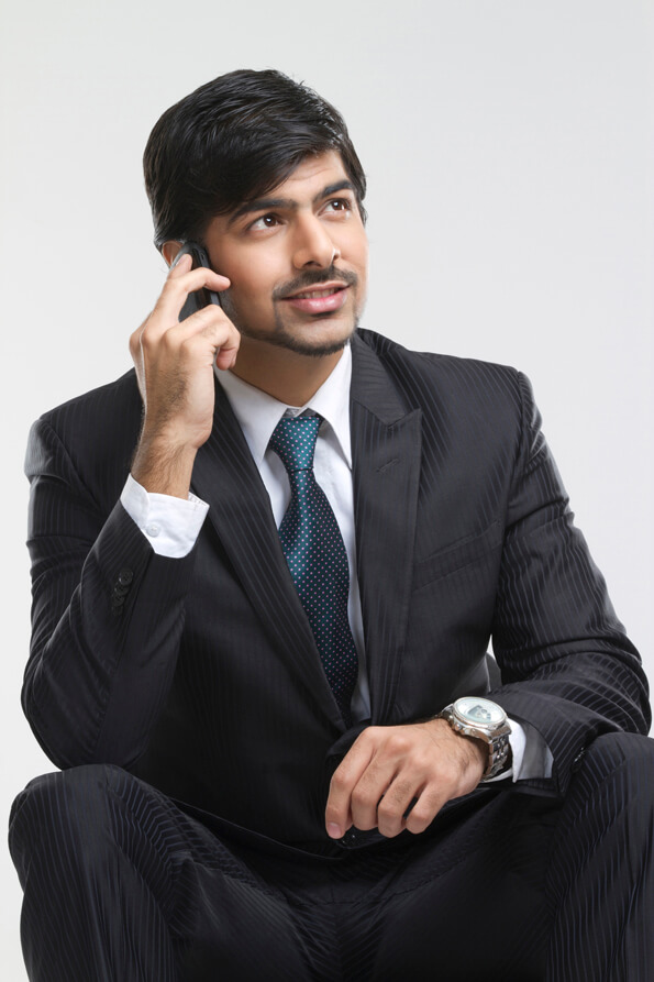 corporate man in a suit talking on phone