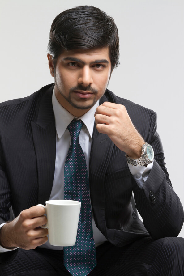 corporate man holding a coffee cup