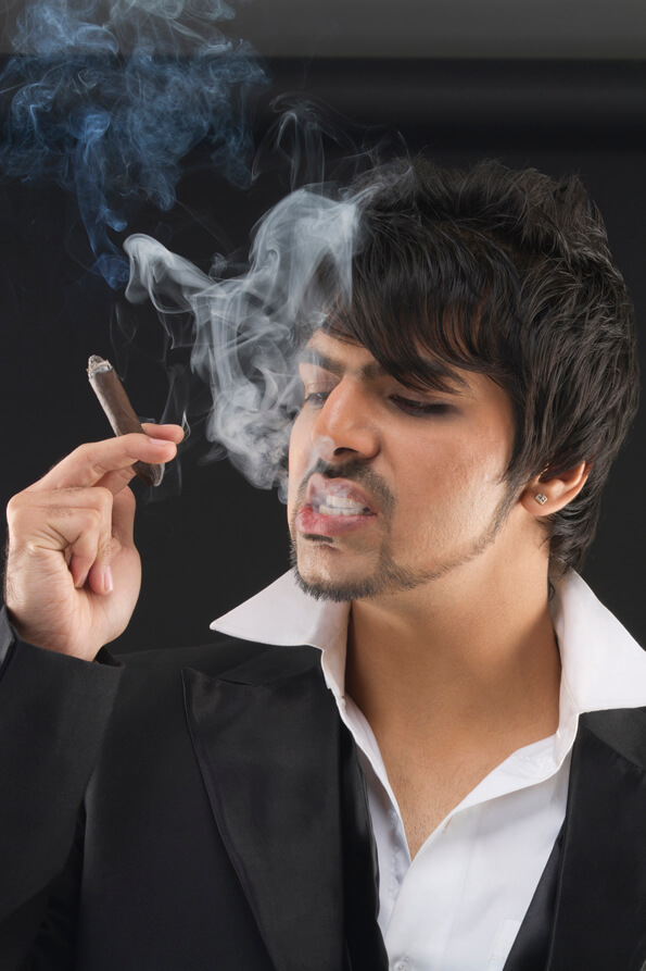 man smoking cigar in style 