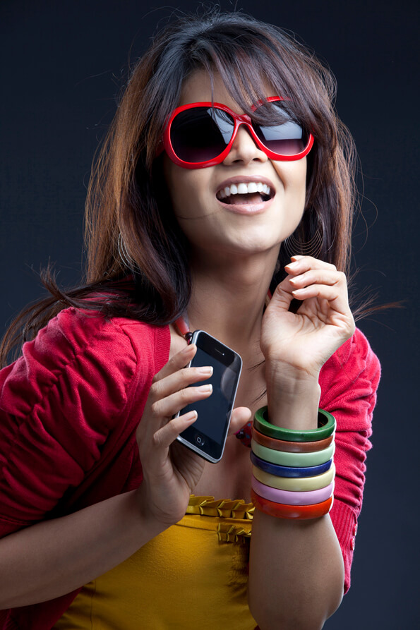 girl posing with mobile phone in trendy wear