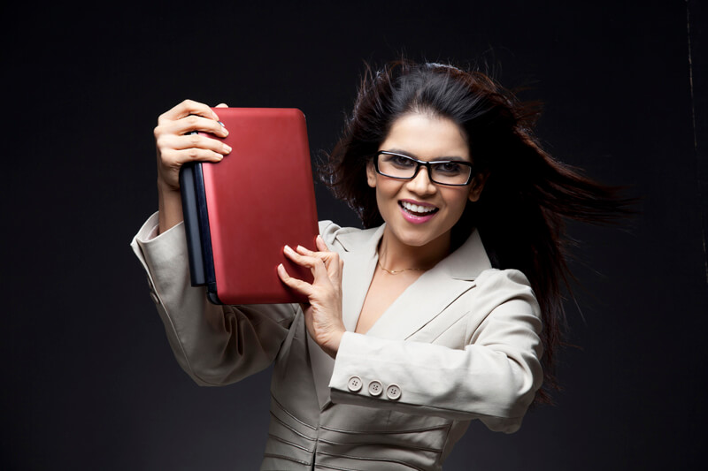 young woman wearing glasses promoting new gadget