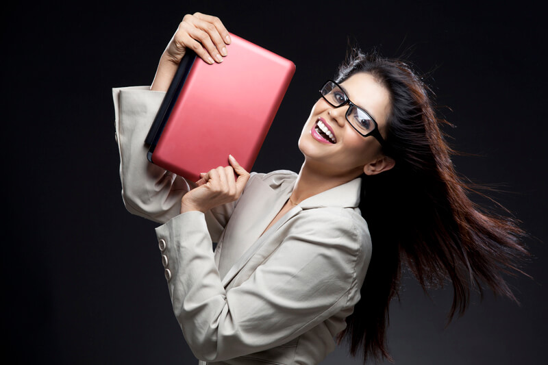 trendy office girl posing with a laptop,